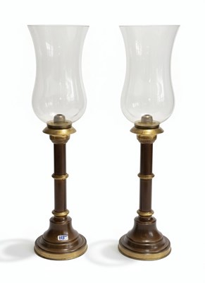 Lot 41 - A Pair of 20th-Century English Patinated-Brass and Glass Hurricane Lamps