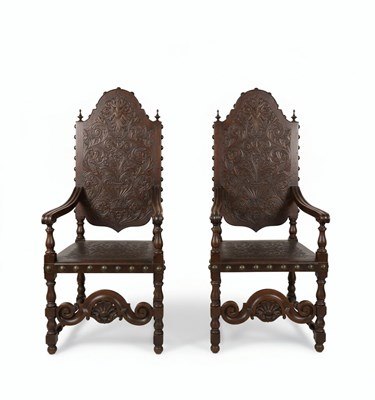 Lot 67 - A PAIR OF 20TH CENTURY GERMAN NEO-RENAISSANCE ARMCHAIRS
Carved dark wood and embossed leather with brass studding