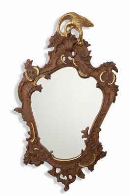 Lot 69 - A 20TH CENTURY GERMAN ROCOCO REVIVAL MIRROR
Carved wood with gilt accents and a silvered mirror plate.
