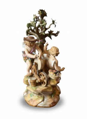 Lot 88 - A Meissen porcelain model of Cupid sharpening his arrows