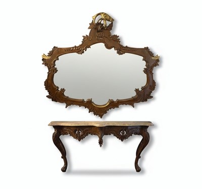 Lot 112 - A 20TH CENTURY ROCOCO REVIVAL CONSOLE TABLE WITH MARBLE TOP AND A CARVED MIRROR
Carved dark wood with a marble top and a silvered mirror plate with gilt accents.
