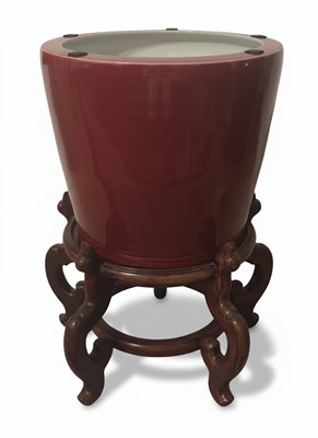 Lot 128 - A 20th-Century Chinese 'Sang de Boeuf' Glazed Porcelain Jardinière with Stand