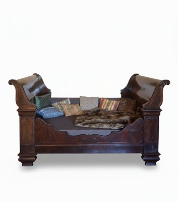 Lot 144 - A LATE 19th early 20TH CENTURY EMPIRE REVIVAL DAYBED OR 'LIT BATEAU'
Mahogany or similar dark wood with modern upholstery.