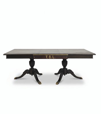 Lot 145 - A 20TH CENTURY PORTUGUESE EMPIRE REVIVAL PEDESTAL DINNING TABLE
Dark wood with brass hardware and feet caps.