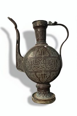 Lot 162 - A engraved and patinated copper ewer
19th century or earlier