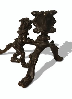 Lot 166 - A cast bronze and patinated bronze candlestick
Japan, Meiji period (1868 - 1912)
