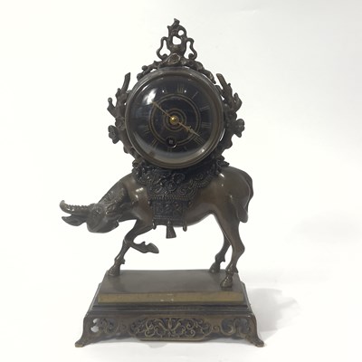 Lot 53 - A cast and Patinated Bronze Clock with Buffalo and Orientalist Mounts