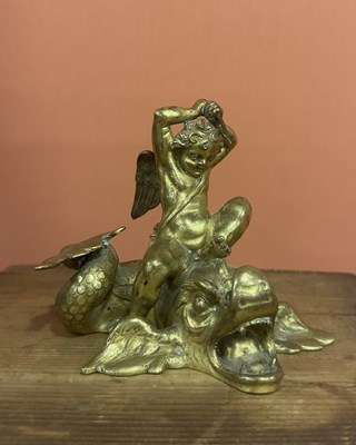 Lot 29 - A chased and gilt-bronze group of a cupid harpooning a dolphin
