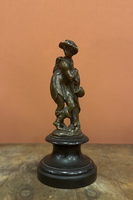 Lot 32 - A cast bronze goup of a resting peasant