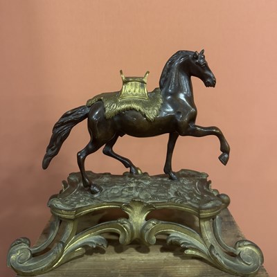 Lot 40 - A cast and patinated gilt-bronze of a horse