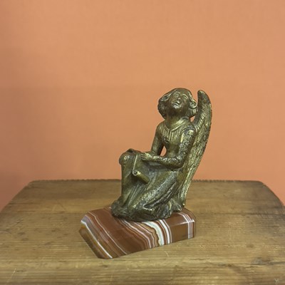 Lot 26 - A Cast gilt- Bronze figure of a Kneeling Angel Holding a Phylactery