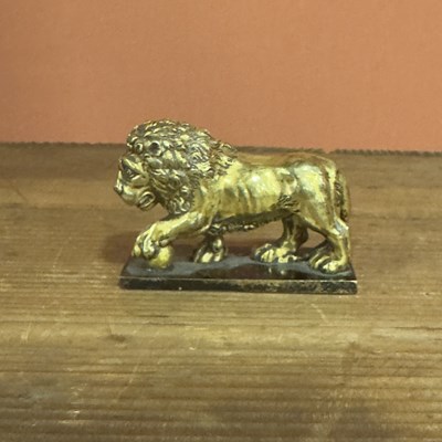 Lot 37 - A Cast Gilt Bronze Figure of a Lion