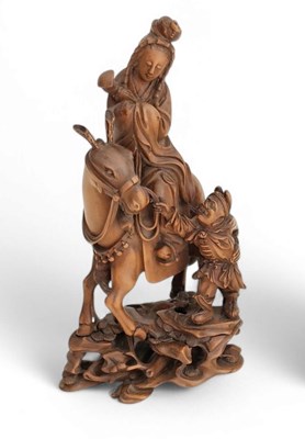 Lot 158 - A Finely Carved Boxwood Group Depicting Guanyin on a Mule