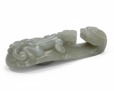 Lot 150 - A Carved Chinese Celadon Jade Belt Hook (Dàigōu)