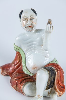 Lot 173 - A Porcelain Figure of a Seated Immortal