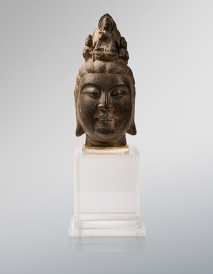 Lot 105 - A carved limestone head of Guanyin
