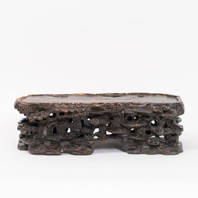 Lot 181 - A carved and patinated hardwood stand