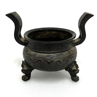 Lot 109 - An archaistic cast bronze tripod insence burner