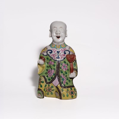 Lot 105 - A 'Famille Rose' Porcelain Figure of a Kneeling Boy