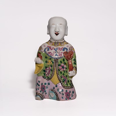 Lot 104 - A 'Famille Rose' Porcelain Figure of a Kneeling Boy